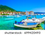 Seafront view at coastal town Komiza on Island Vis, summer travel resort in Croatia, Mediterranean.