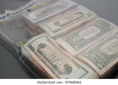 Sealed Bank Deposit Bag Filled With Bundles Of Cash.
