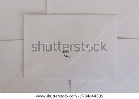 A sealed envelope with a handwritten “with love” message