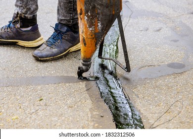 Sealing Joint Crack In Asphalt Road Surface Restoration Work Asphaltic Joint