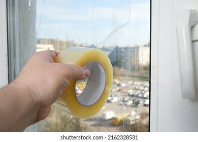 Sealing The Windows With Adhesive Tape During The War In Ukraine To Prevent The Formation Of Many Fragments During The Blast Wave.