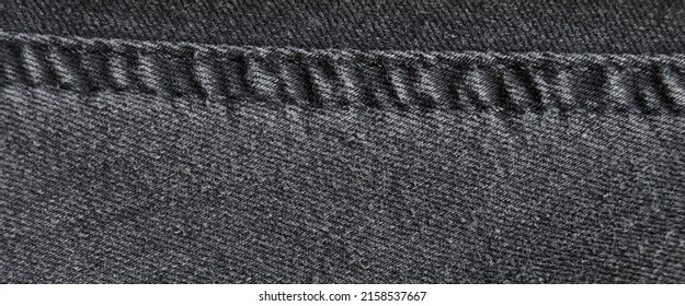 Seam black denim cotton jeans fabric texture background and wallpaper - Shutterstock ID 2158537667