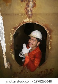 A Seaman Is Inside The Ballast Tank During Inspection Of Frame And Tank Condition 