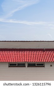 Seamless angled rooftop of rustic red tiles shot straight on.