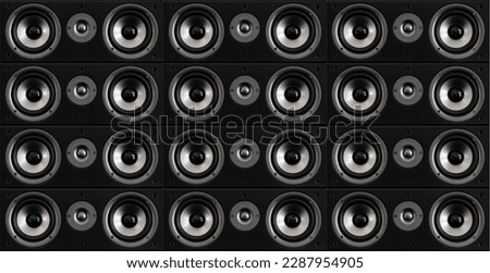 Seamless background of hi-fi speakers with tweeters between them in black wood enclosure