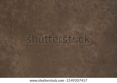 Seamless brown concrete texture. Stone wall background. Surface of the concrete old floor in scratches, which you can use as overlay in your design. High quality photo