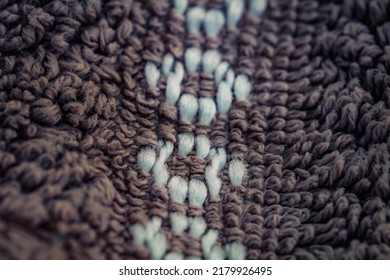 Seamless Close Up Of Carpet With White Round Ornament. Textile Texture Background From Above.