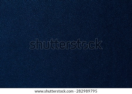 Seamless deep blue leather texture background surface closeup