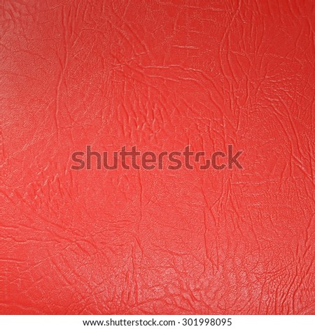 Seamless deep red leather texture background surface closeup