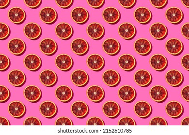 Seamless Fruit Pattern With Round Blood Orange Slices On A Bright Pink Background, Pop Art Style Of The Sixties