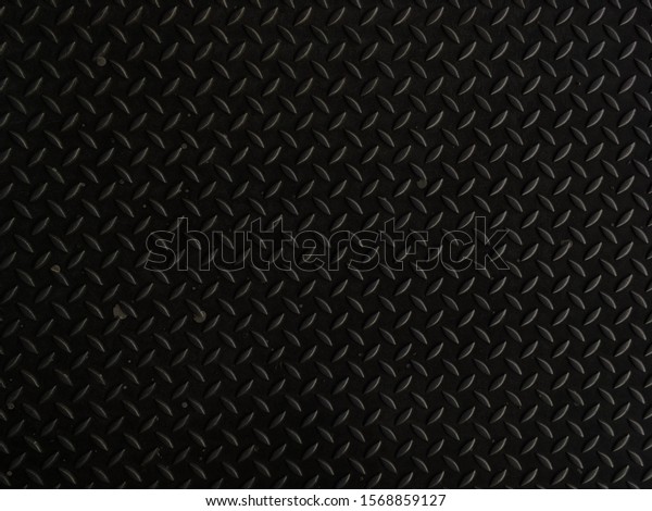 Seamless Metal Floor Plate With\
Diamond Pattern.Black metal background or black steel\
surface