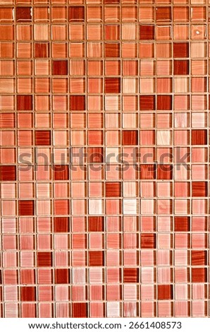 A seamless mosaic tile texture in various shades of red, including crimson, burgundy, and scarlet. Ideal for interior wall designs, kitchen backsplashes