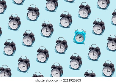 Seamless Pattern Of Black Retro Alarm Clocks  Show 3 O'clock And One Blue Shows 2. Changing Clock From Summer Time To Winter Time. Shifting The Clock Hands Back In Autumn.