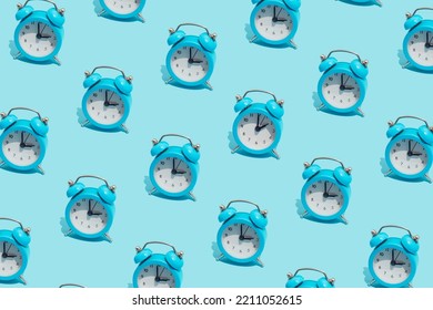 Seamless Pattern Of Blue Retro Alarm Clocks  Show 3 O'clock And One Shows 2. Changing Clock From Summer Time To Winter Time. Shifting The Clock Hands Back In Autumn.