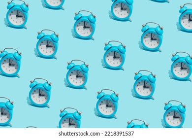 Seamless Pattern Of Blue Retro Alarm Clocks  Show 3 O'clock. Changing Clock From Summer Time To Winter Time. Shifting The Clock Hands Back In Autumn.