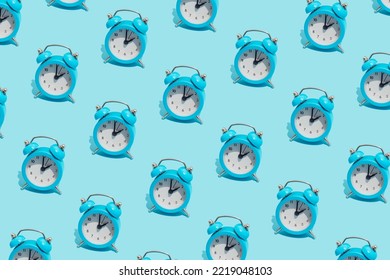 Seamless Pattern Of Blue Retro Alarm Clocks  Show 2 O'clock. Changing Clock From Summer Time To Winter Time. Shifting The Clock Hands Back In Autumn.