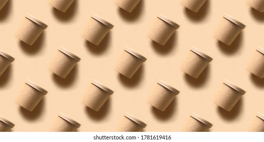 Seamless pattern of craft paper soup cups with shadow on brown paper background. Container for take away food. Ecological individual package. Zero Waste.