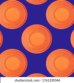 Seamless pattern with flying target plates against the blue background
