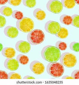 Seamless pattern with lemon, lime and grapefruit slices. Fruit background. Creative design for wrapping paper, printing on fabrics, clothing, products.