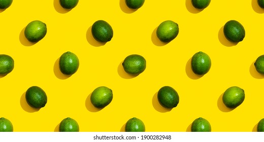 Seamless Pattern From Limes On A Yellow Background.