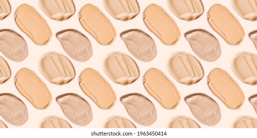 Seamless pattern of liquid foundation cream swatch smear. Light beige makeup concealer stroke on a pale yellow background. Nude makeup base swipe