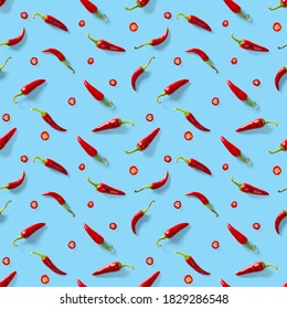 Seamless Pattern Made Of Red Chili Or Chilli On Blue Background. Minimal Food Pattern. Red Hot Chilli Seamless Peppers Pattern. Food Background.