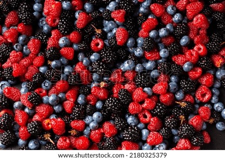 Seamless pattern raspberry blackberry and blueberry. Tropical abstract background. Flatley raspberries blackberries and blueberries. Abstract background of useful berries