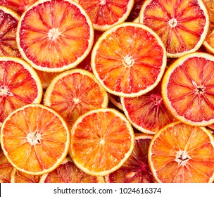 Seamless pattern with red Sicilian oranges. Top view.