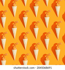 seamless pattern. small pumpkin in a ice cream cone. theme halloween, autumn