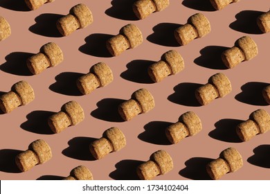 Seamless pattern of wine bottle caps on a pink background