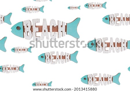 Seamless pattern of wooden home decoration sign in shape of blue fish with beach lettering used as decorative detail isolated on white background