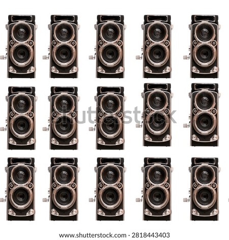 A seamless, repeating pattern featuring vintage twin-lens cameras on a black back-ground.