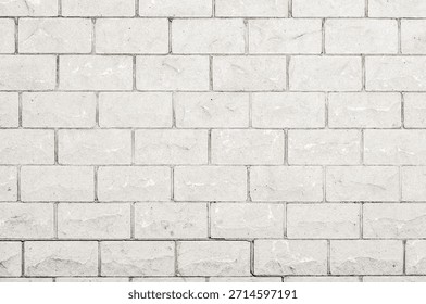 A seamless, repeating pattern of light grey bricks with a rough, natural texture and thin, dark grey grout lines