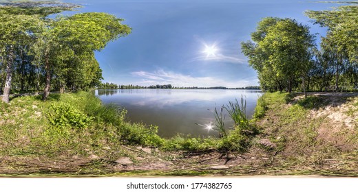 seamless spherical hdri panorama 360 degrees angle view on grass coast of small lake or river in sunny summer day with beautiful clouds in blue sky in equirectangular projection, VR content