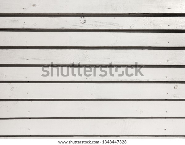 Seamless texture background, boards natural
old painted white. White wood pattern and texture for background.
Close-up image. Old wood
background.