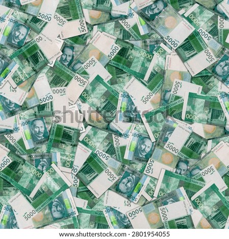 seamless texture and full-frame background of scattered 5000 Kyrgyzstani som banknotes, directly above view