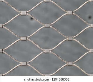 Seamless Texture Of Hand Woven Mesh Fence Made Of Stainless Steel Wire. New York. USA.