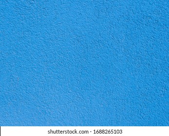 Seamless Texture. The Plastered Wall Is Painted With Blue Paint. Rough Surface