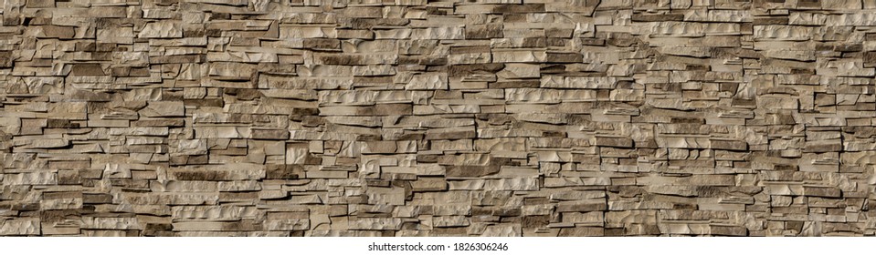 Seamless texture wall stone sandstone with shadows and deep texture.  background of clinker tiles or bricks on the wall in the form of wild stone. Panorama beige and brown tones with shadows and deep 