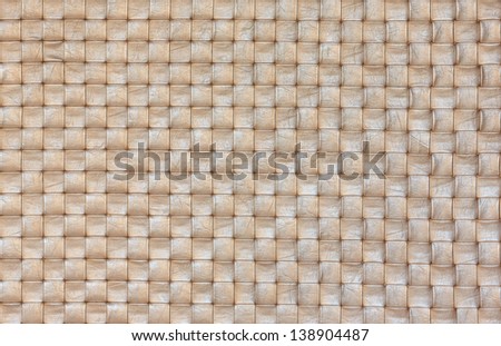 A seamlessly tiling texture of leather basketwork