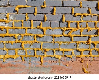 Seams covered with mounting foam in brickwork - Shutterstock ID 2213683947