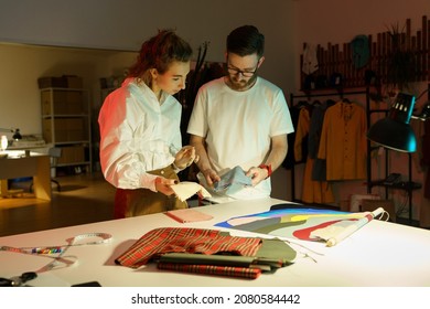 Seamstress female consult with fashion designer stylist on textile for new collection. Creative young adult self-employed tailors work together in atelier. Entrepreneurship and small business concept - Powered by Shutterstock