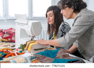 a seamstress and her apprentice with sewing machine - Powered by Shutterstock