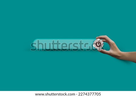 Search bar and hand hold wooden button to turn off, closed, and shut down on green soft background with copy space. Care of the Environment. Earth Day Concept