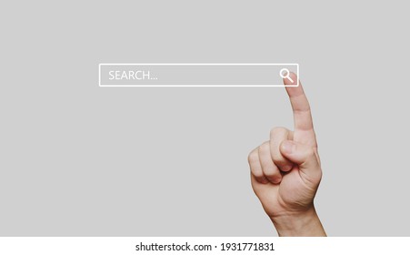 Search bar internet data browser. Man hand presses the information search button on computer touch screen,copy space.