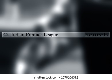 A Search Bar Written Indian Premiere League (IPL) And Blurred Image Of A Human Hand Wearing Cricket Hand Gloves And Holding A Bat.