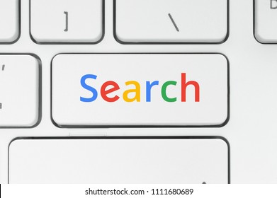 Search concept. Keyboard button with color Search word close-up