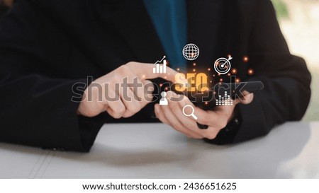Search Engine Optimization concept. Businesses use mobile or smartphones with SEO icons for promote ranking traffic on websites and optimizing.  