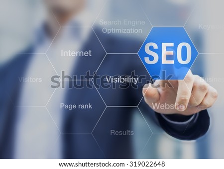 Search Engine Optimization consultant touching SEO button on whiteboard