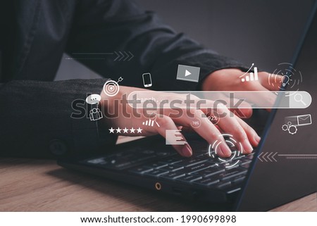 Search Engine Optimization (SEO) concept. Businessman user laptop to search engine tool. Find customers or promote and advertise on online content for technology, marketing or analytics and business.